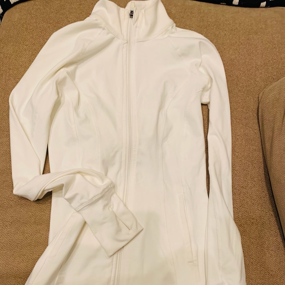 Fitting white athletic jacket